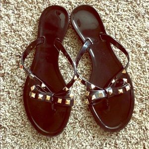 Black studded jelly sandals